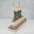 This antique pedestal, made of finely carved and lacquered wood, is a refined antique piece ideal for enhancing historic...
