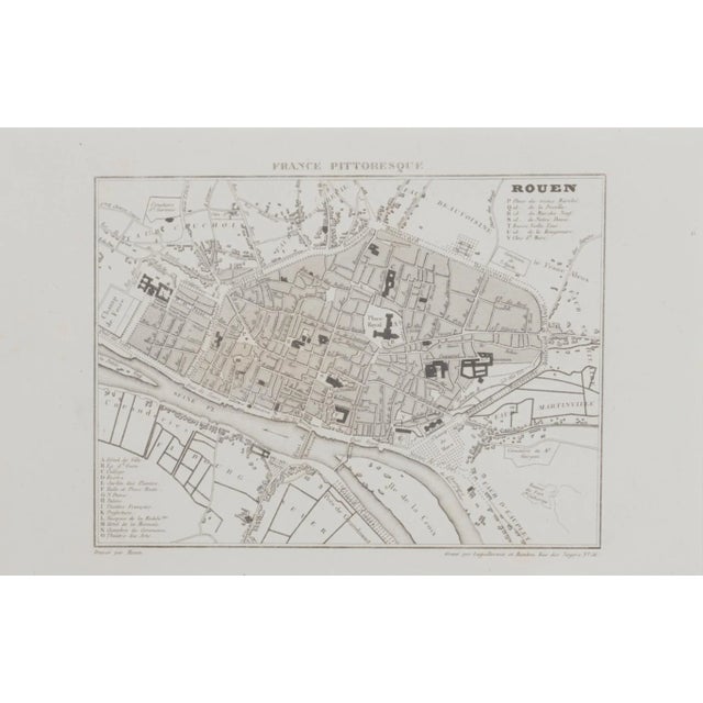 Map of Rouen is an original etching realized by an Anonymous engraver of the 19th Century. Printed within the series of...