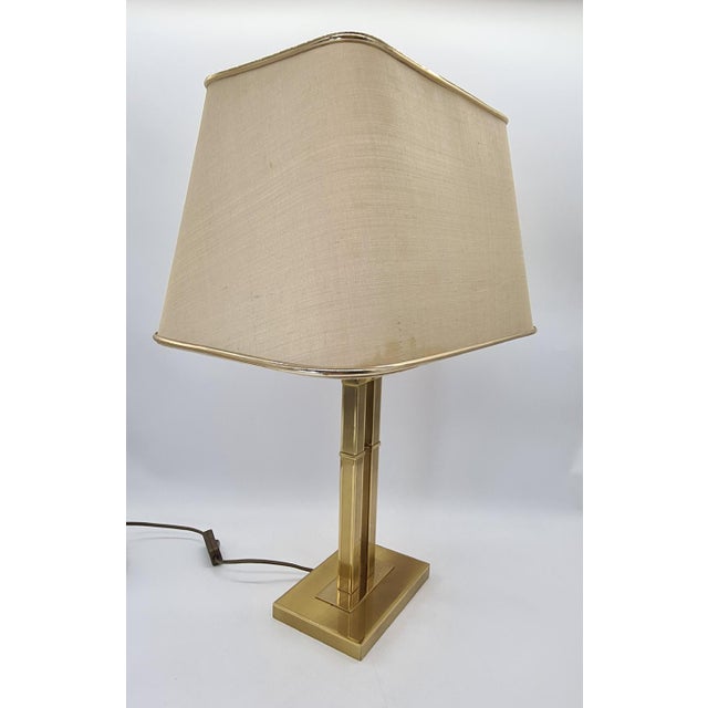 An elegant table lamp manufactured in switzerland by jjs (swiss made, gland). This piece retains its original silver...