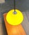 Rare train pendant lamp by Guzzini designed by Luigi Massoni. The large plastic shade is finished in yellow. On the...