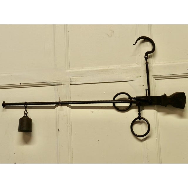Early 19th century butchers steelyard for weighing scale. A good original industrial piece, the balance has blacksmith...