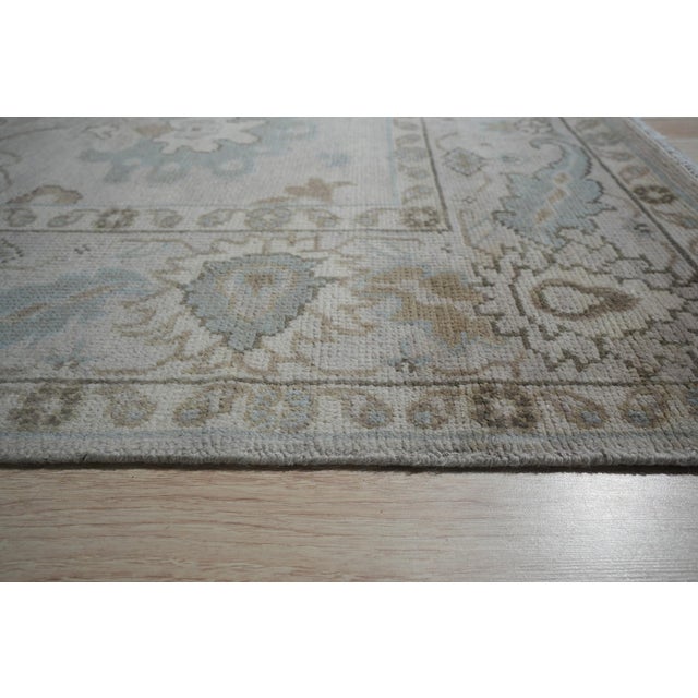 Classic Tessa Beige Nan Rug, Country of Origin: India. This exquisite piece reflects the enduring quality and refined...