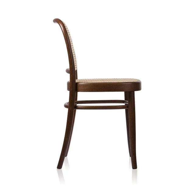 This chair boasts a seat and backrest covered in Viennese straw, and a frame and structure in solid beechwood that was...