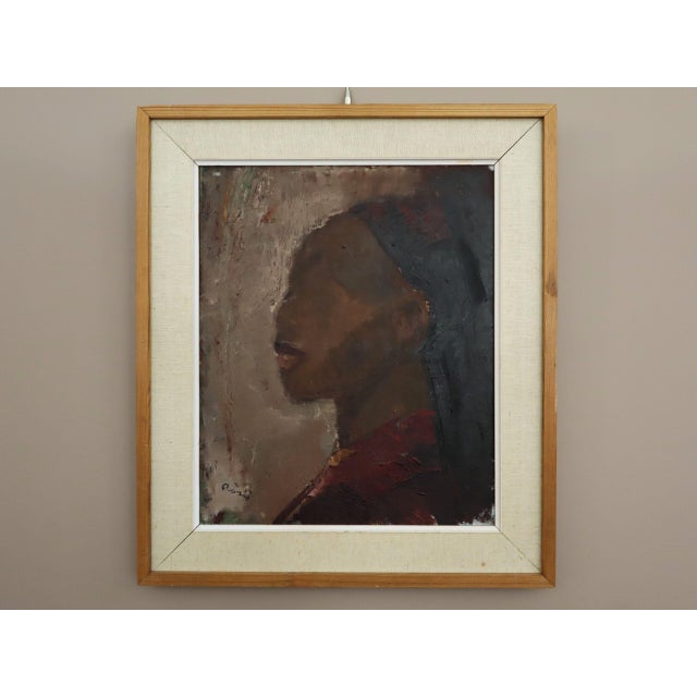 PROFILE IN BURGUNDY Size: 23.2 x 20.5 inches (including frame) Oil on canvas An intriguing and emotive mid-century...