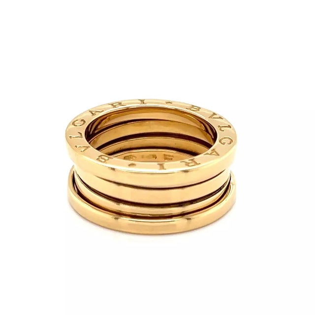This is an authentic three band ring by Bulgari from their B.zero1 collection, it is crafted from 18k yellow gold in a...