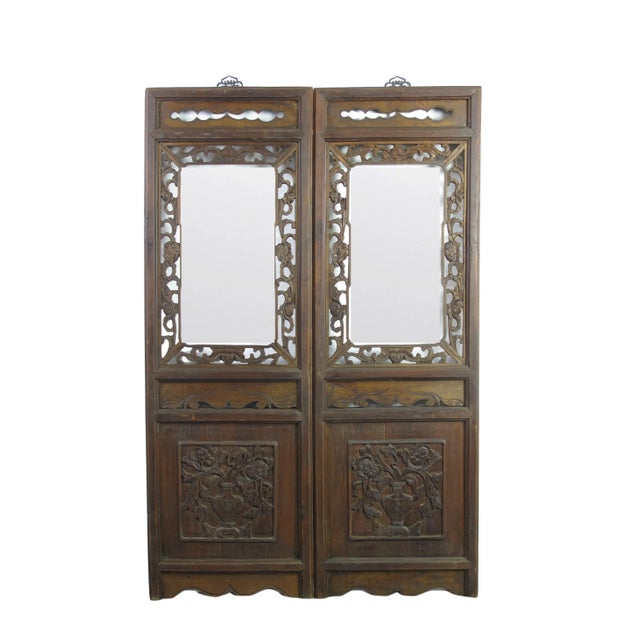 The frame of this vintage mirror is decorated with beautifully hand carved flowers and vines. This Asian mirror will make...