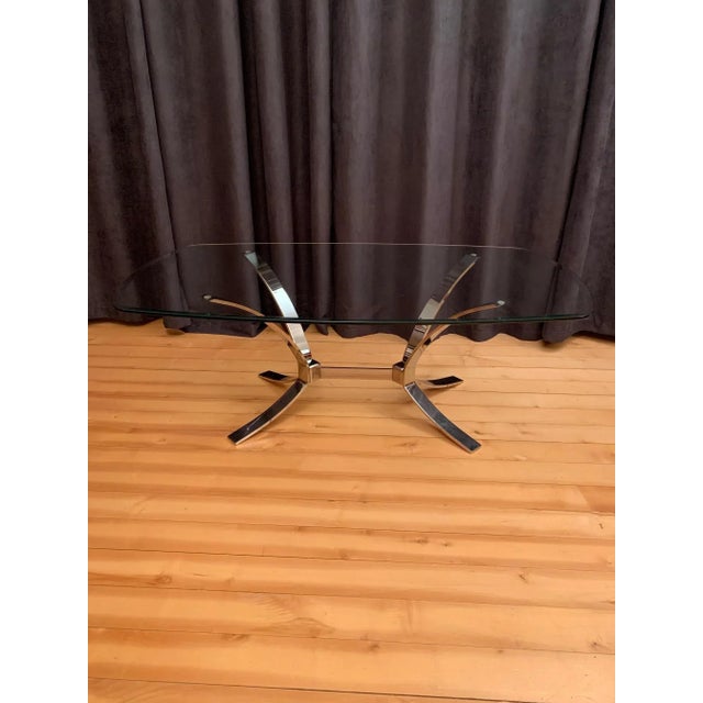 An Italian coffee table from the '70s Fully original and very good condition. The base is made of solid, thick and chrome-...