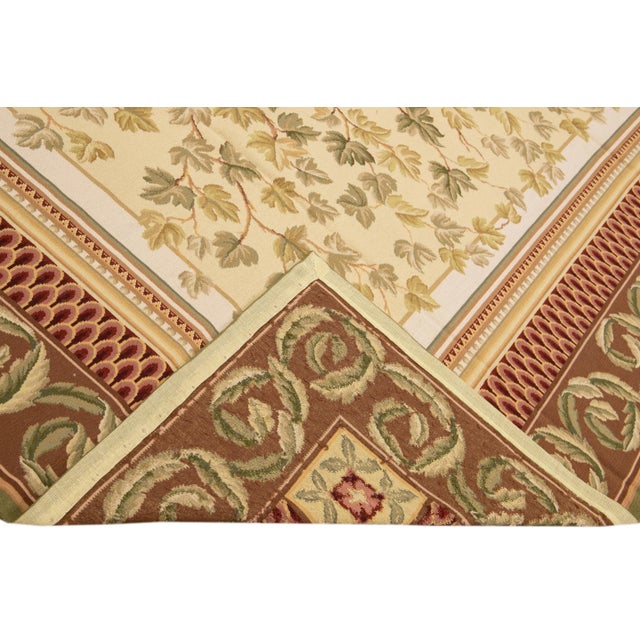 Beautiful Vintage Portuguese Arraiolos needlepoint wool rug with a beige field. This piece has fine details in a...