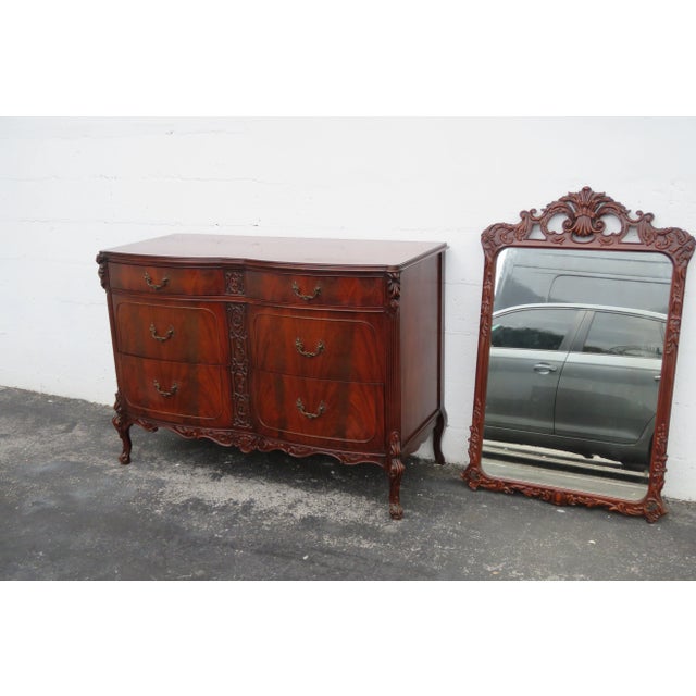 This high quality set of Dresser and Mirror is made out of wood, solid wood, mahogany, flame mahogany, veneer, mirror, and...