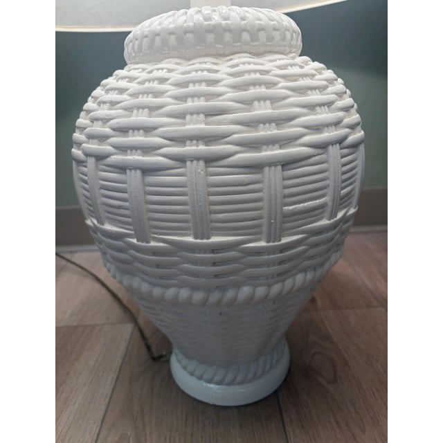 Base 6in across Lamp shade 20in across Entire lamp is about 28in tall White ceramic table lamp with a basket weave...