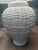 Base 6in across Lamp shade 20in across Entire lamp is about 28in tall White ceramic table lamp with a basket weave...