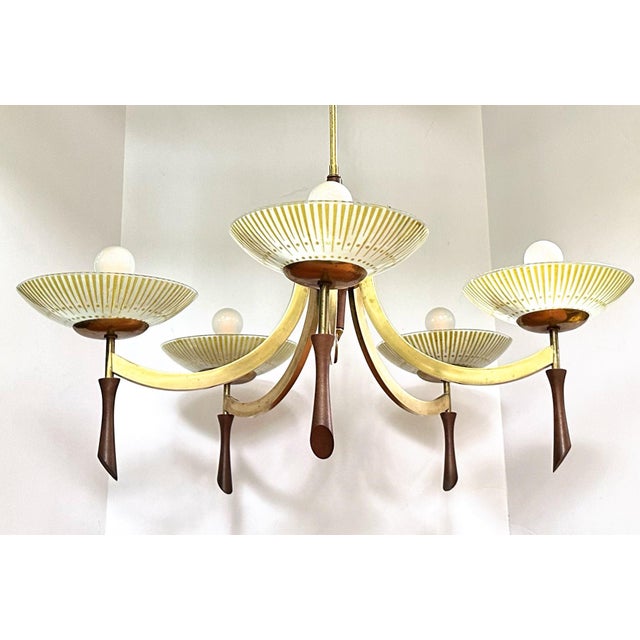 Stunning vintage 1960s 5-light brass and wood chandelier. The starburst shades are period-appropriate vintage...