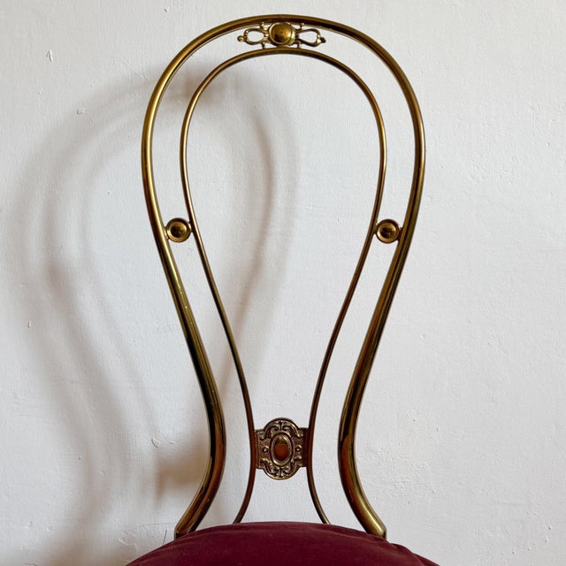 Vintage Italian brass chair attributed to Paolo Buffa, dating to the mid-20th century. The chair features a sculptural...
