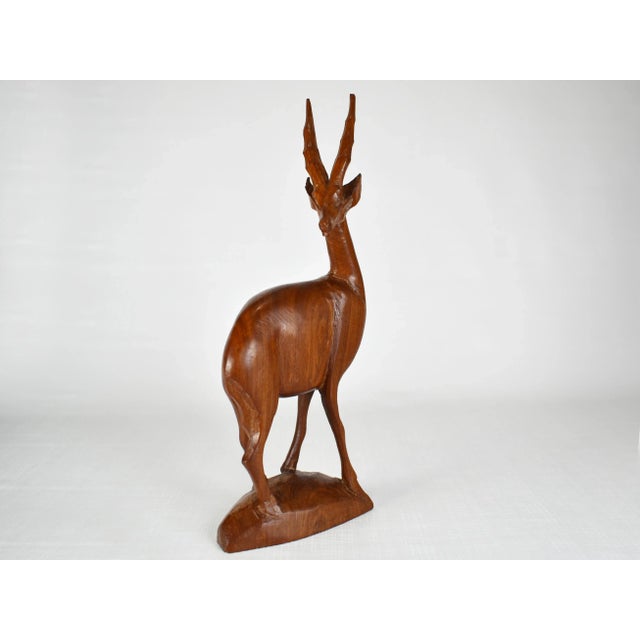 Hand Carved from Solid Wood and In excellent condition.