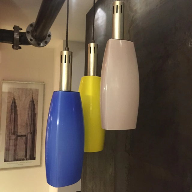 This pendant by Stilnovo Milano from the 1950s features three well-preserved multi-colored glass diffusers. The structure...