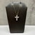This diamond cross necklace is crafted in 14kt yellow gold and features a timeless cross pendant adorned with 1.10 carats...