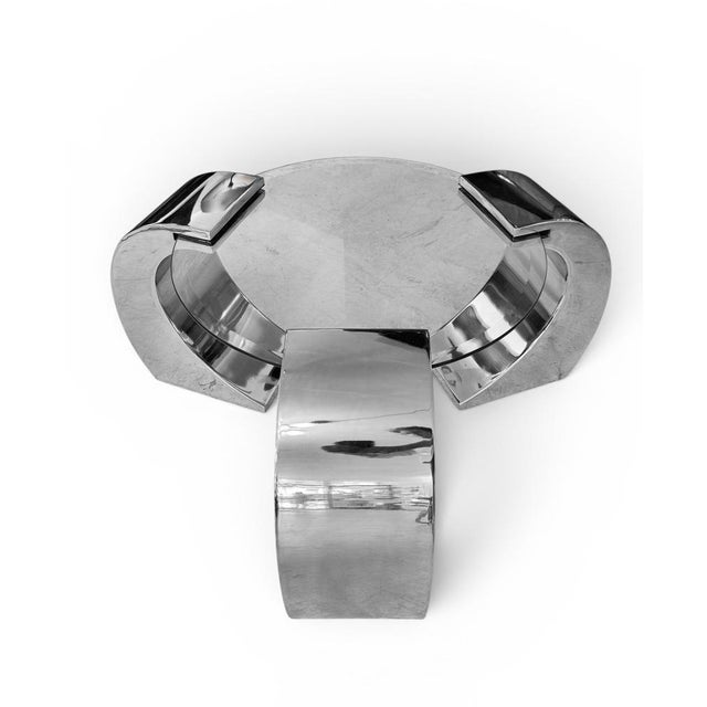 An exceptional vintage chrome and glass coffee table featuring an elegant sculptural cantilever design, inspired by the...