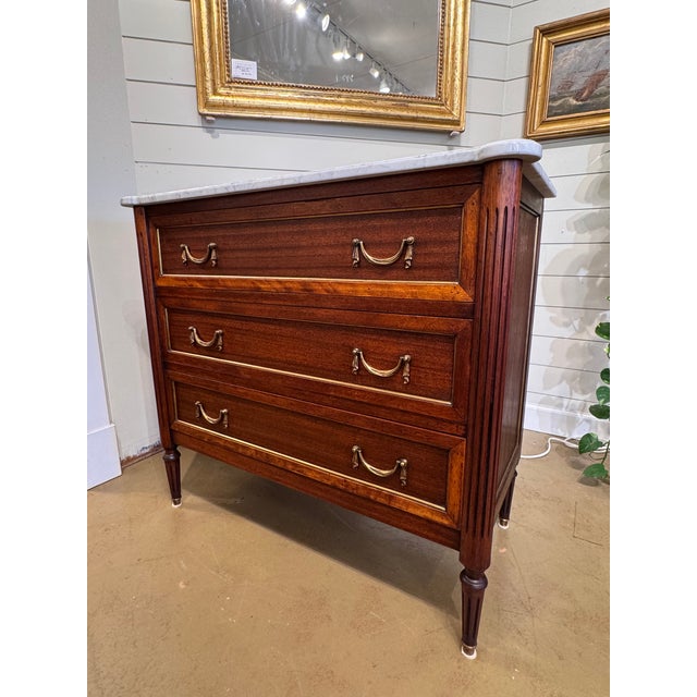 This is a beautiful 19th century French chest of drawers with white marble top! The wood is a gorgeous auburn tone with...