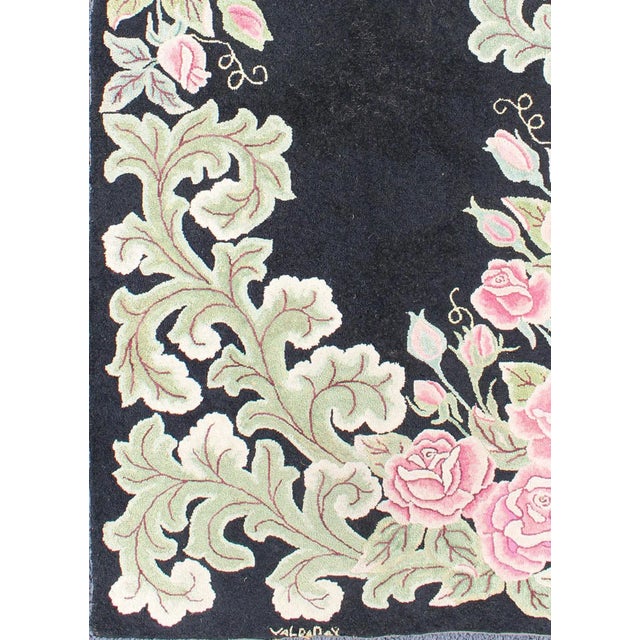 American hooked rug in black background. This beautiful antique American Hook rug sets on black background with large...