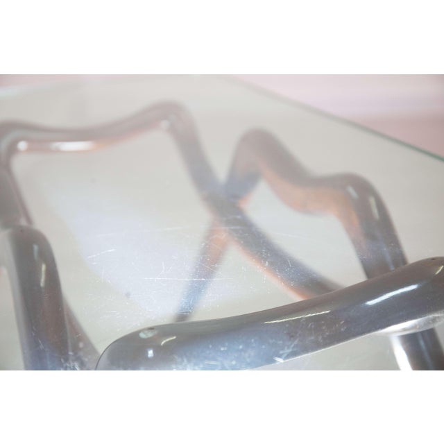 An elegant coffee table attributed to Melchiorre Bega, dating back to the 1950s and made in Italy. This refined piece...