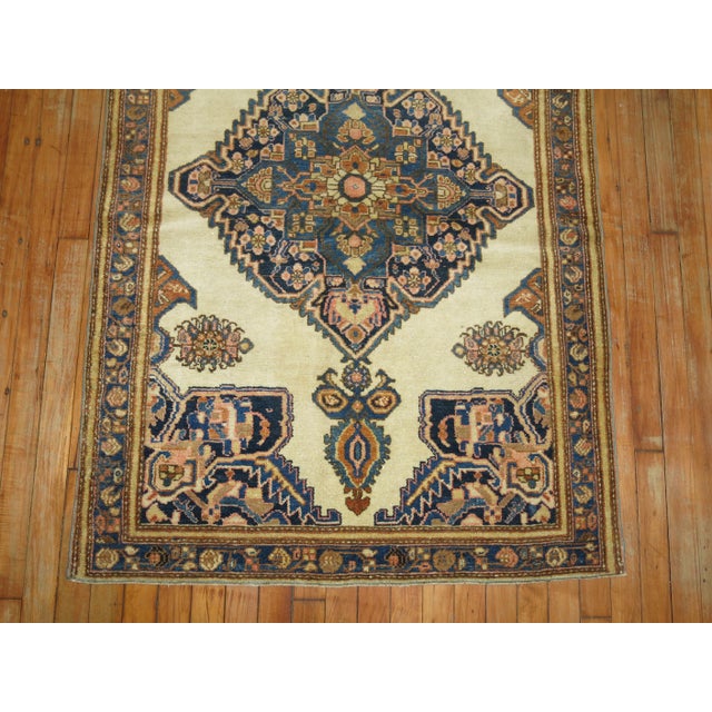 Authentic Persian Ferehan throw rug with an ivory field. 3'3'' x 5'1''