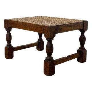 Vintage English Oak Footstool With Woven Cane Top and Turned Legs. For Sale