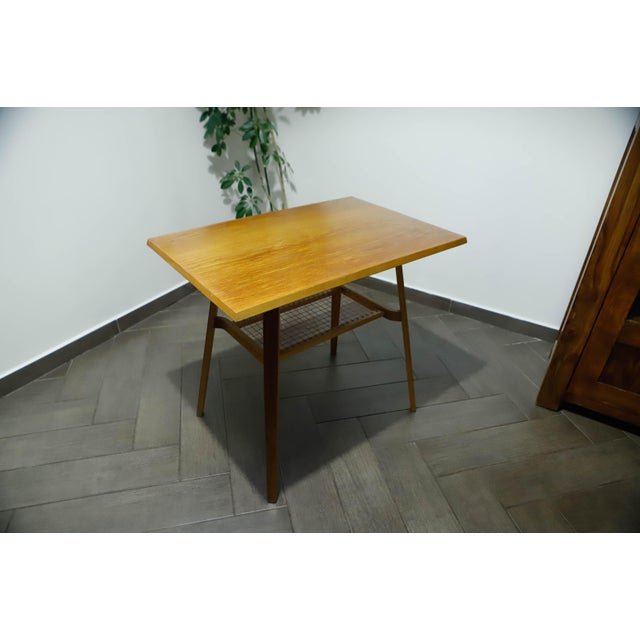 This distinctive Brussels-style side table was designed by Jindřich Halabala and manufactured by Dřevopodnik Holešov in...