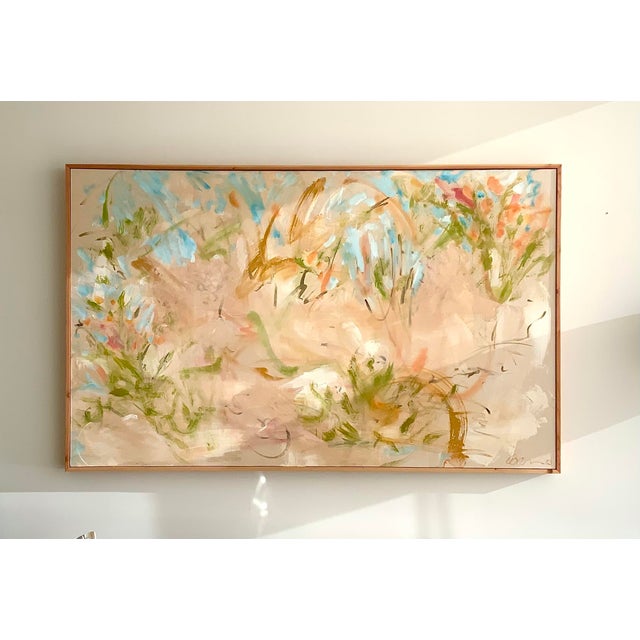Bring the soft serenity of nature indoors with Wildflowers, a one-of-a-kind abstract floral painting inspired by the quiet...