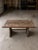 Antique ship hatch door turned into a table on a custom steel base, this is a 2 piece table, the bolts go through the top...