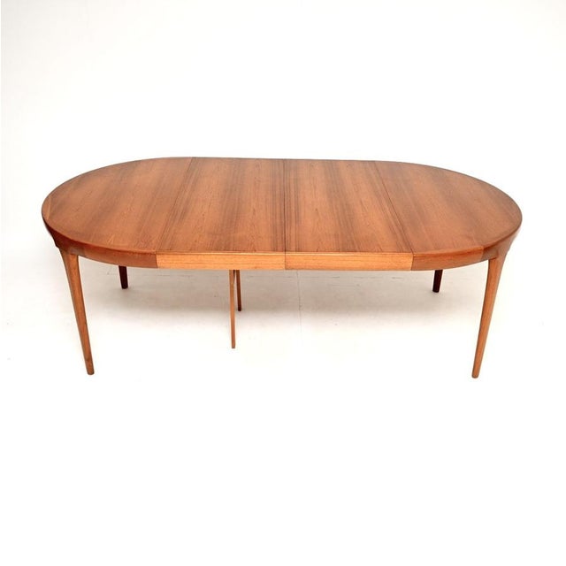 A stunning Danish vintage teak extending dining table by IB Kofod Larsen. It was made in Denmark, and dates from the...