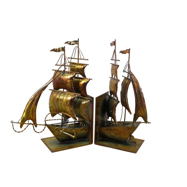 Vintage late 20th century nautical copper / tin / brass bookends in the shape of an old maritime sailing ship with four...