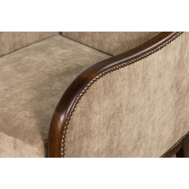 Exceptional pair of French Art Deco club chairs with matching ottoman, sourced in Paris and dating to circa 1930. The...