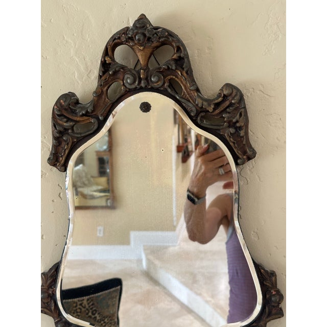 Charming antique Nurre Maestro wall mirror by The Nurre Companies, Inc., dating to approximately the 1930s–1940s and...