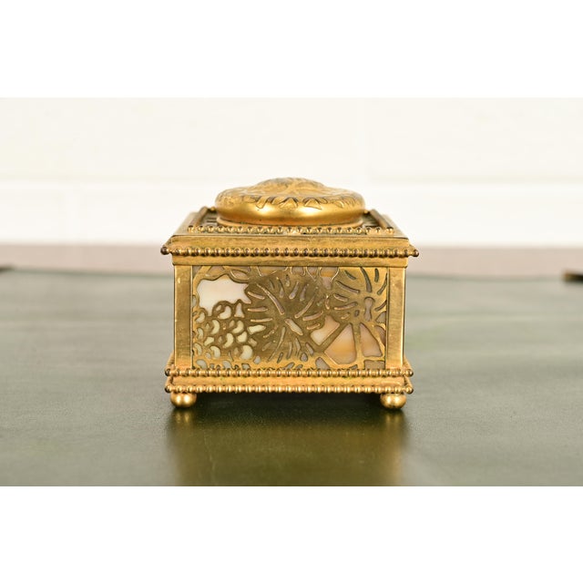 A gorgeous Arts & Crafts or Art Deco period "Grapevine" pattern gilt bronze and Favrile slag glass inkwell By Tiffany...