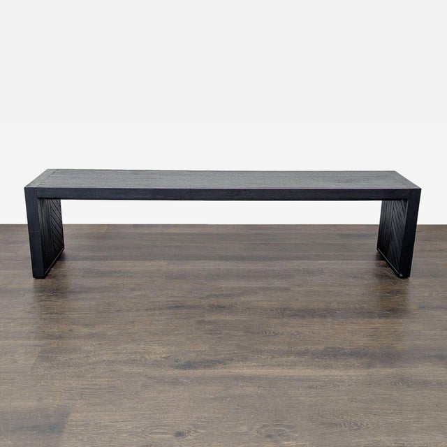Employing the technique of parquetry, skilled woodworkers add artisan rusticity to the contemporary Dunewood dining bench....