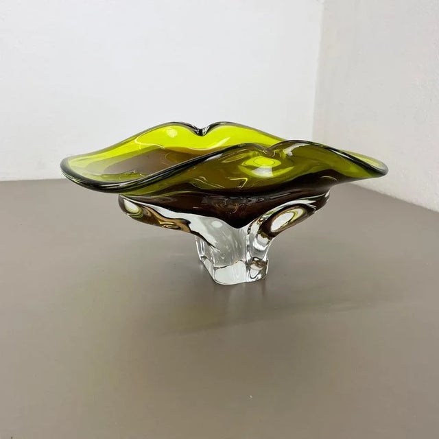 Murano glass bowl centerpiece. Origin: Murano, Italy. Decade: 1970s. This original vintage glass shell bowl element was...