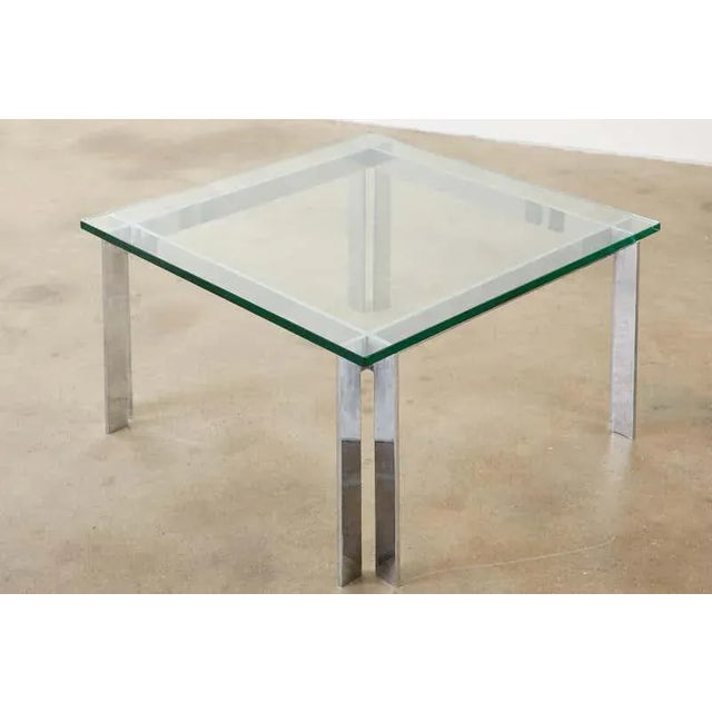 Mid-century modern chrome and glass coffee or cocktail table attributed to Milo Baughman. Crafted from 4 flat steel bars...