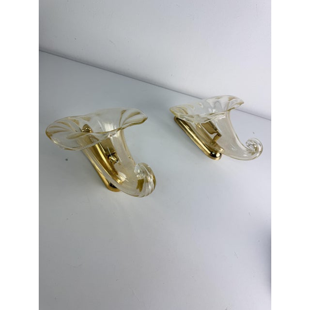Set of two Murano glass wall lamps, "Cornucopia" model, 1960s Gold leaf glass, gold-plated metal frame. E27 bulbs. Glass...
