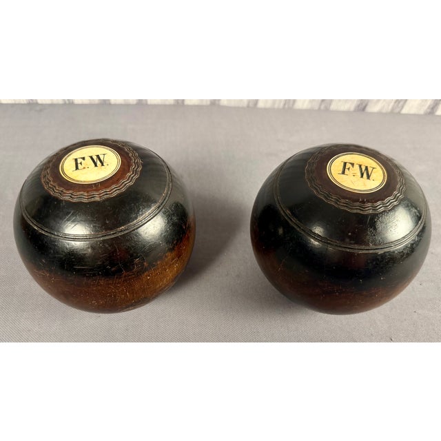 Pair of Early 20th Century Scottish Monogramed Hardwood Lawn Balls by Thomas Taylor of Glasgow. Made of dense lignum vitae...