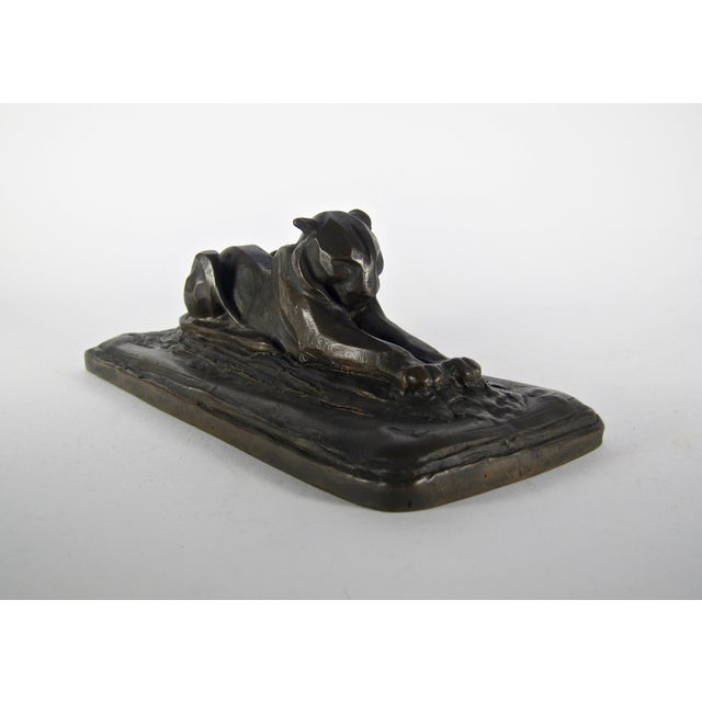 A stylish lioness bronze from the Art Deco period modeled with outstretched front paws designed by noted American...