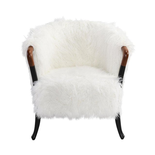 Chic and comfortable white faux fur arm chair with two toned wooden arms and legs. Seat height is 19".