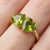 Celebrate love and vibrant elegance with this exquisite Dual Heart Peridot Ring, a beautifully crafted piece that...