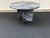 A stunning and rare vintage coffee table made of dramatic grey/black/white Ruivina style marble. Circular shaped top rests...