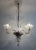 Beautiful true vintage chandelier with up-going arms and light bulbs inside beautifully handcrafted glass bowls. Made in...