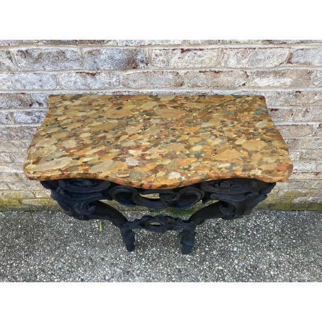 Wall-mounted console with a faux marble painted top. The console base itself has recently been burned and painted black to...