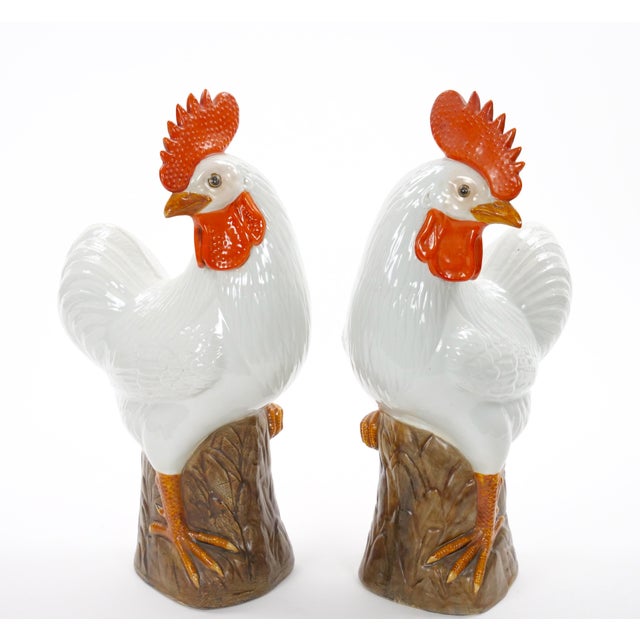 This impressive pair of large Chinese porcelain rooster sculpture dates to the 1930's and features beautifully rendered...