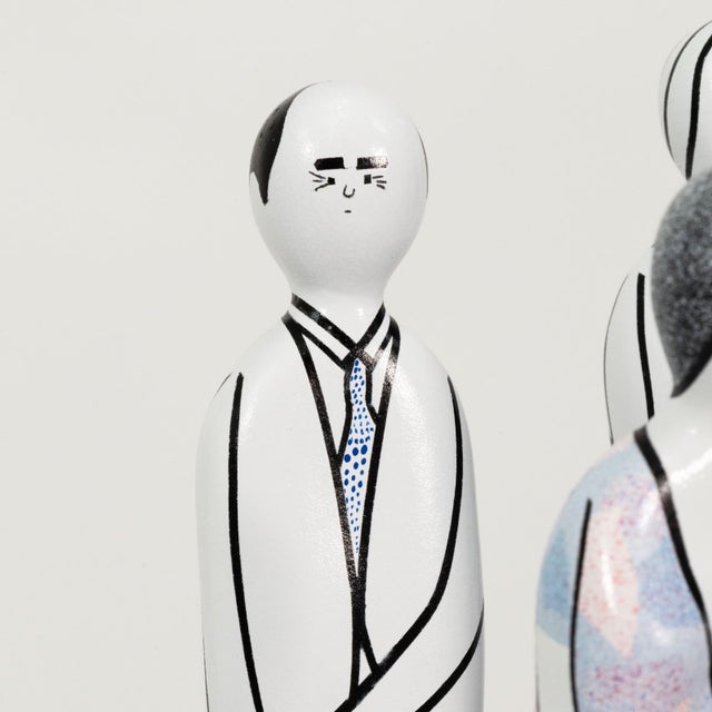 A whimsical mixed-media sculpture by Italian artist Guglielmo Gusella depicting a group of gallery visitors gathered...