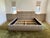 A bespoke king bed frame designed by AD100 designer Andrew Mellone of Studio Mellone, showcasing the designer's signature...