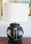 This is a vintage hand painted Anglo Indian style black and white rice basket lamp. Sophisticated, cool and not at all...