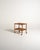 Scandinavian 1960s oak serving trolley with raised-edge shelves, curved crosspieces, and exposed metal screws....